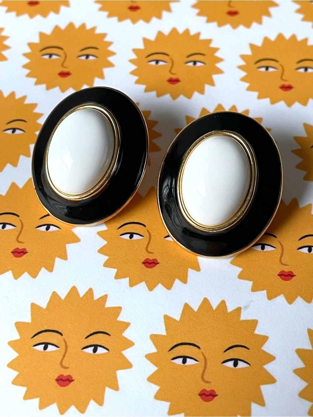 Signed vintage Monet goldtone, enamel, lucite (?) clip-on earrings